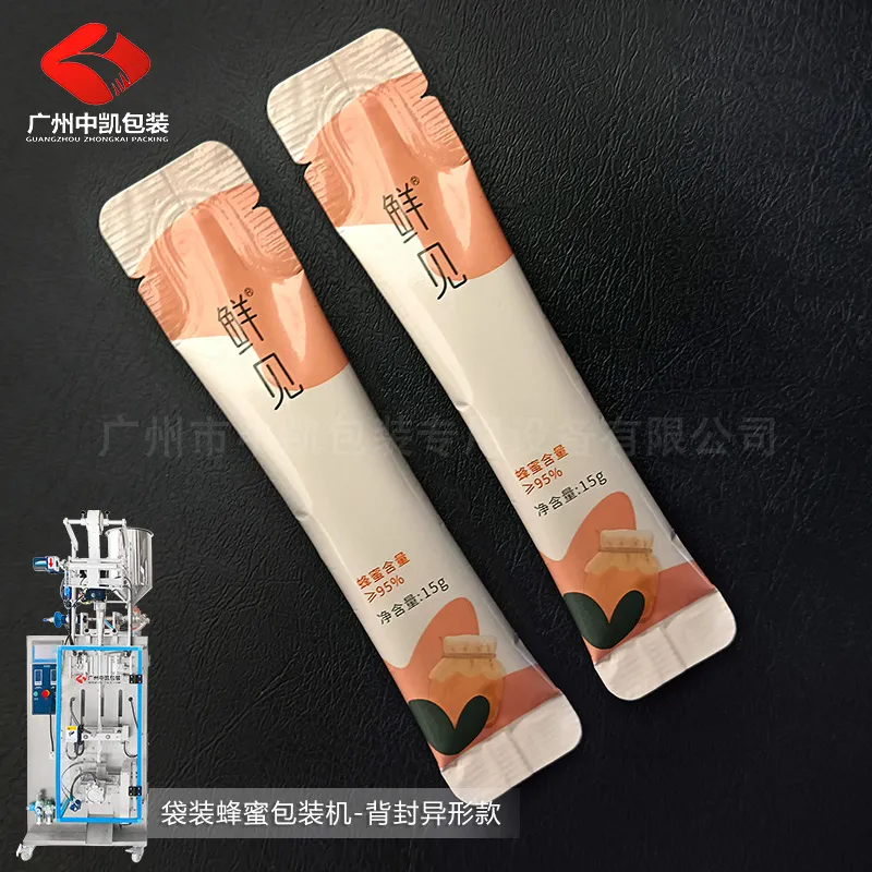 袋装蜂蜜包装机-背封异形款.jpg 袋装蜂蜜包装机-背封异形款.jpg